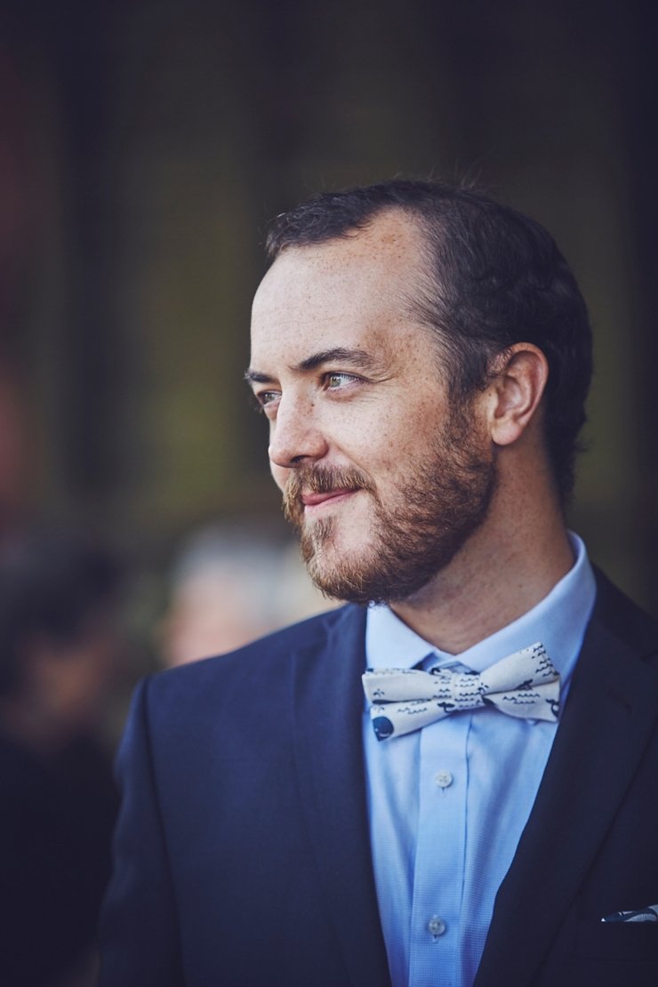 guests holding hands at humanist ceremony at East Soar in Devon