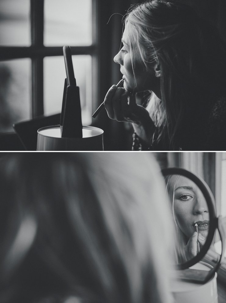 bride putting make up on before wedding at East Soar in Devon