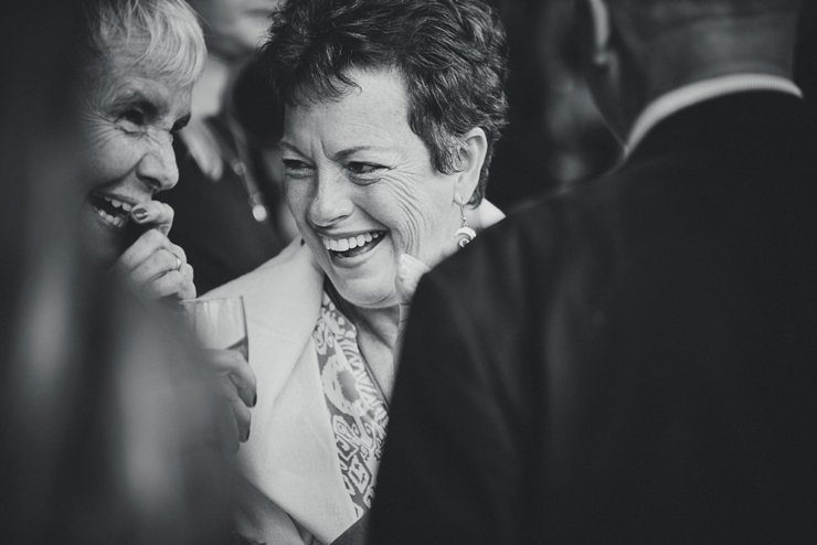 guests holding hands at humanist ceremony at East Soar in Devon