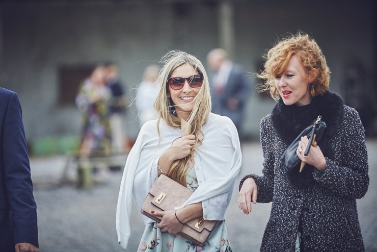guests holding hands at humanist ceremony at East Soar in Devon