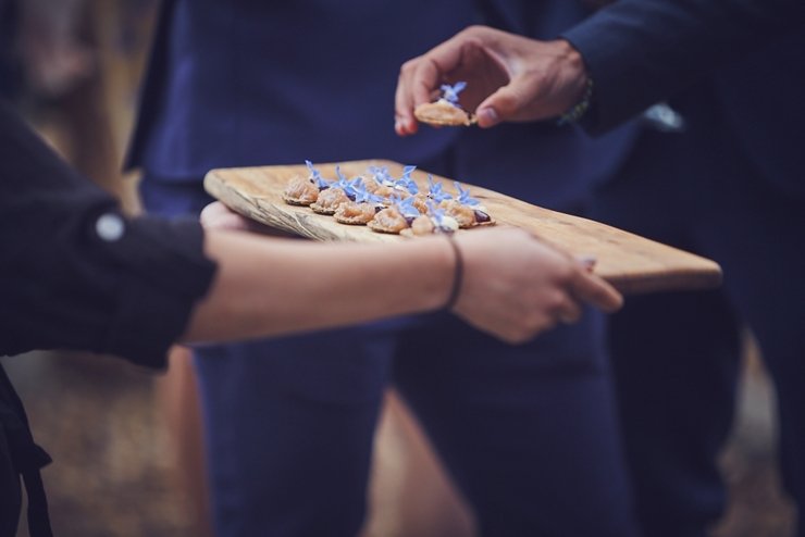 guests holding hands at humanist ceremony at East Soar in Devon