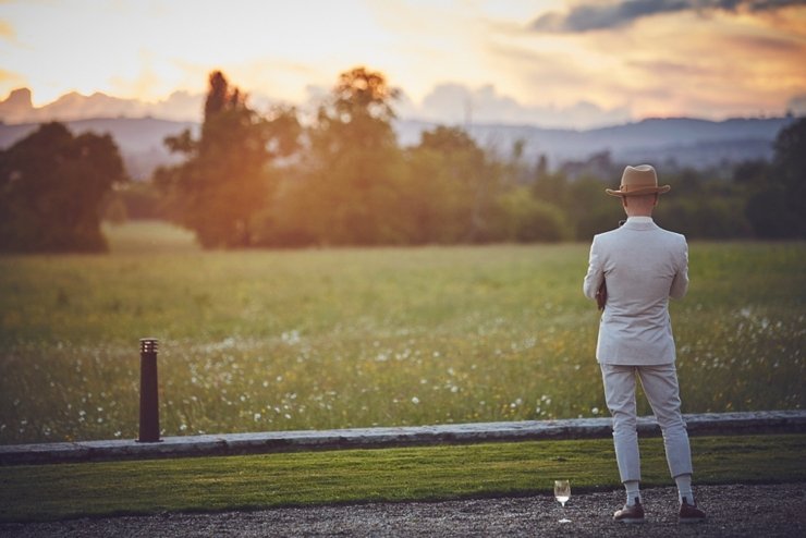 guest at a wedding watching the sunset at Rockbeare Manor in devon