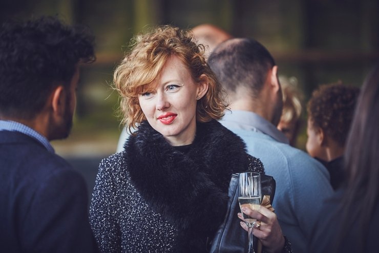 guests holding hands at humanist ceremony at East Soar in Devon