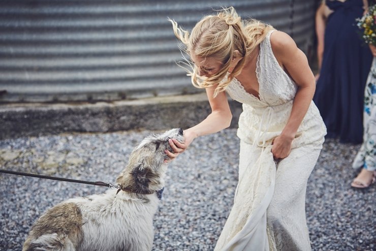 bride putting make up on before wedding at East Soar in Devon