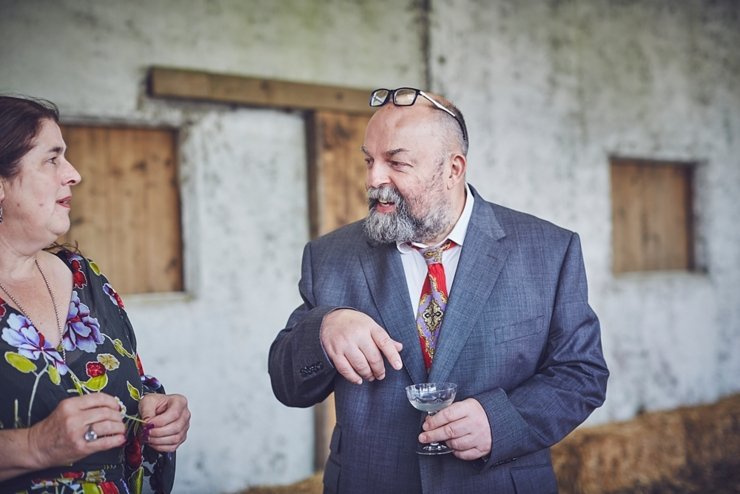 natural wedding photo of happy guest at eco wedding at East Soar Farm in Devon