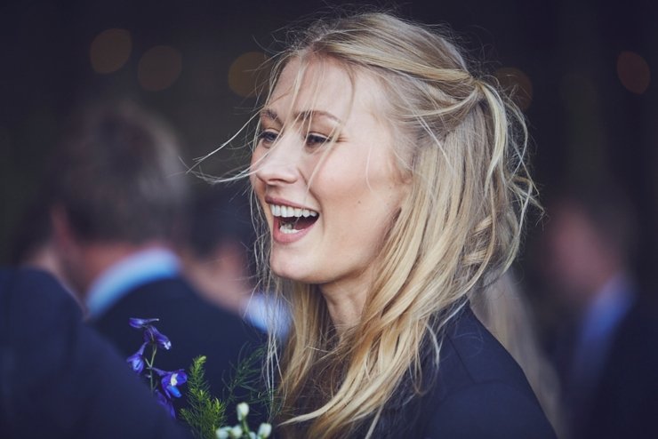 guests holding hands at humanist ceremony at East Soar in Devon